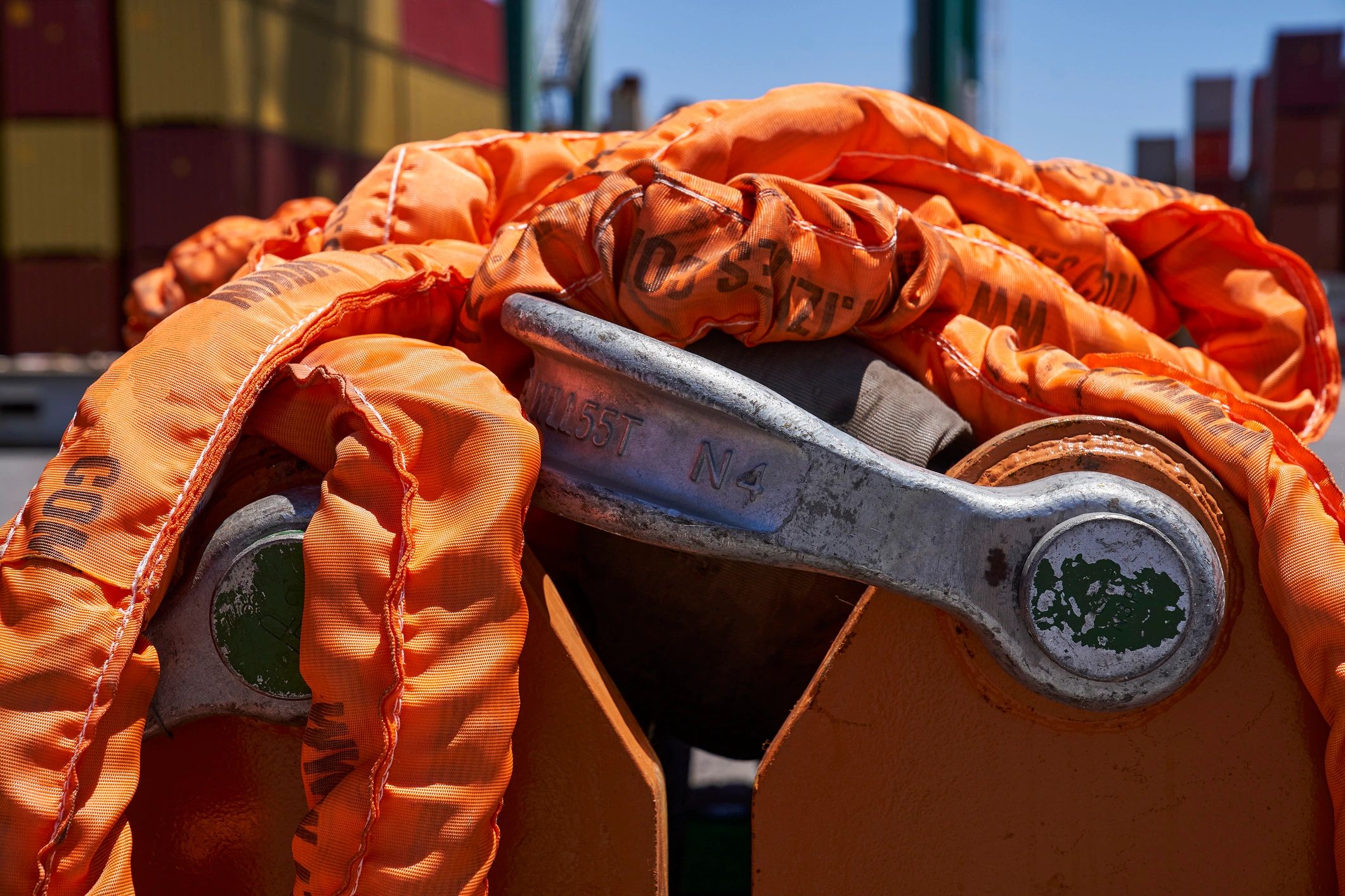 Close-up of an orange lifting sling used for load securement